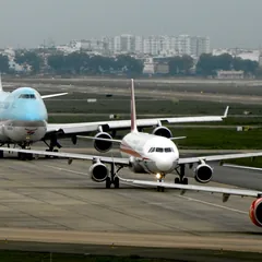 Wide body and narrow body passenger aircraft taxiing at an airport