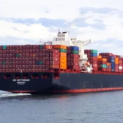 Container ship loaded with cargo containers at sea